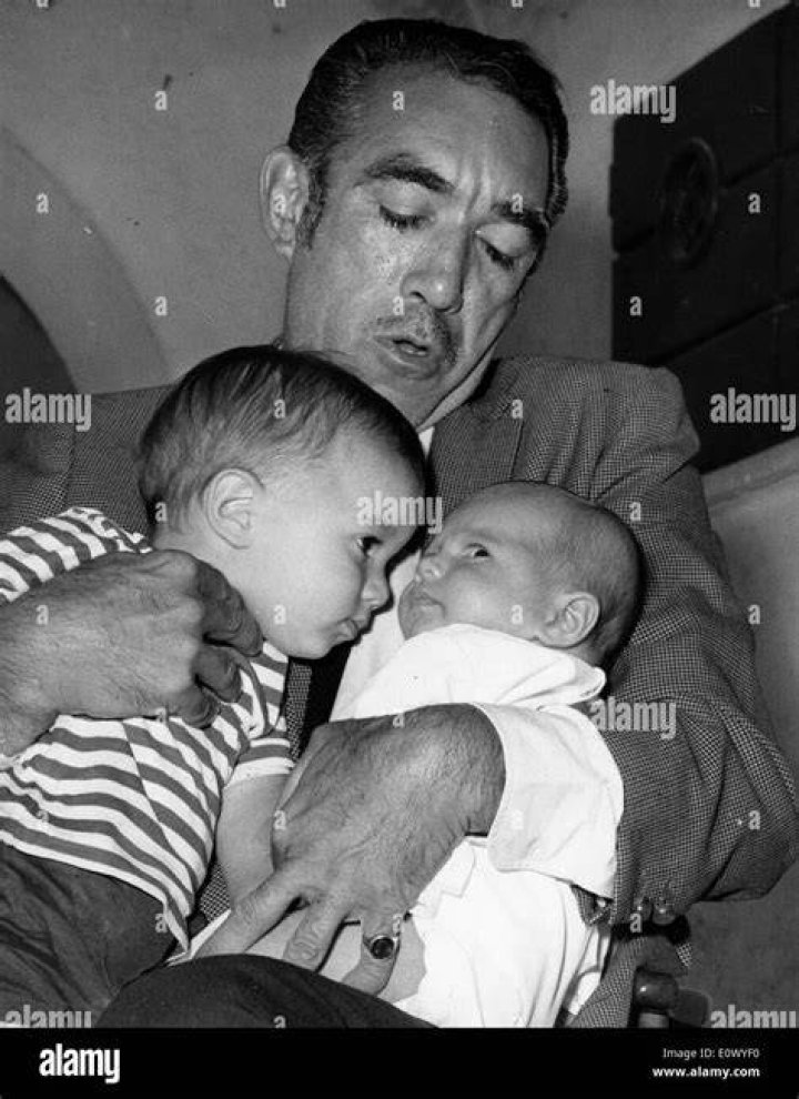 Actor Anthony Quinn holding his two sons Stock Photo Alamy