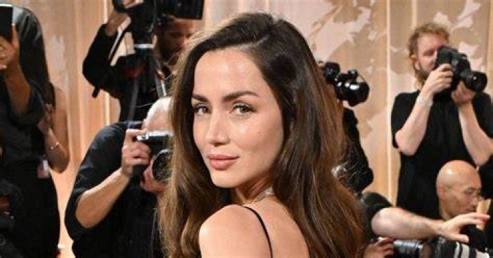 Ana de Armas cozies up to boyfriend Paul Boukadakis as the two kiss and